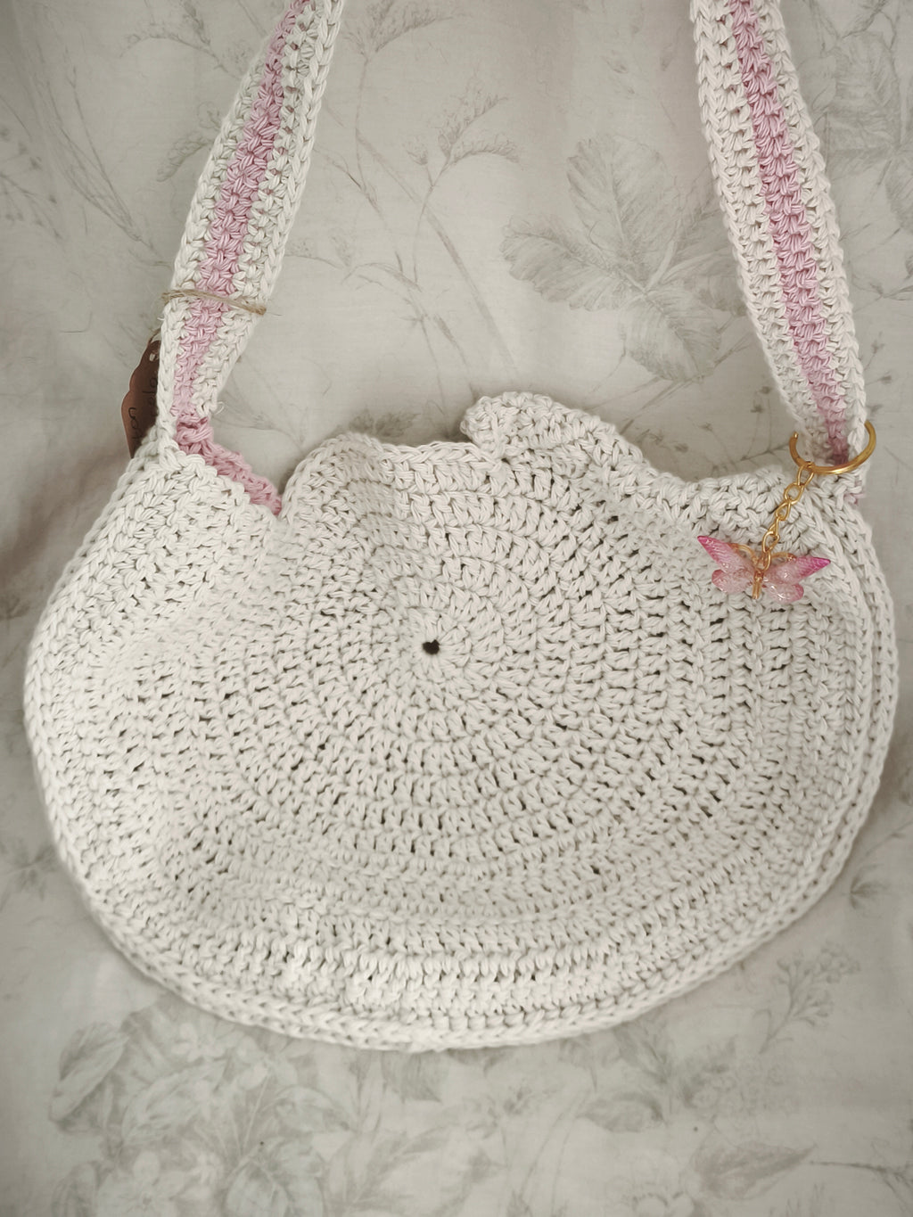 Pink and cream circle messenger bag