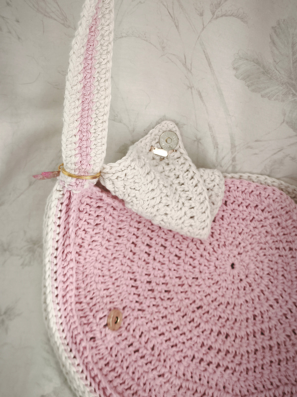 Pink and cream circle messenger bag